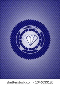 diamond icon inside emblem with denim texture