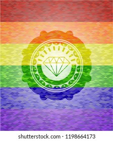 diamond icon inside emblem on mosaic background with the colors of the LGBT flag