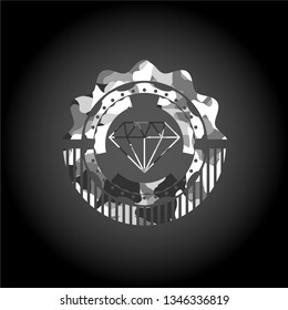 diamond icon inside grey camo emblem