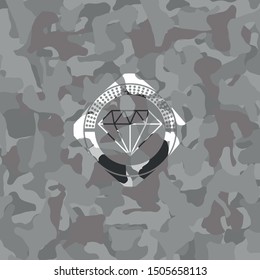 diamond icon inside grey camo emblem