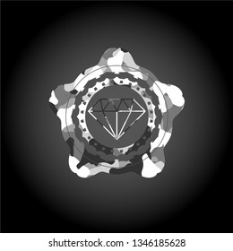 diamond icon inside grey camouflaged emblem