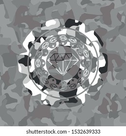 diamond icon inside grey camouflaged emblem
