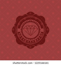 diamond icon inside red emblem