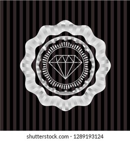 diamond icon inside silver badge or emblem