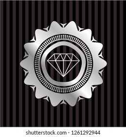 diamond icon inside silvery badge or emblem