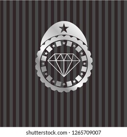 diamond icon inside silvery emblem