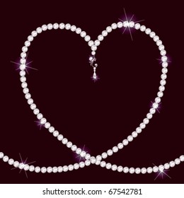 Diamond necklace lying in form of heart on a dark background