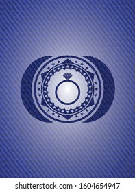 diamond ring icon inside badge with denim texture