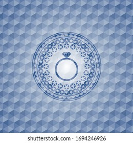 diamond ring icon inside blue emblem or badge with abstract geometric polygonal pattern background.