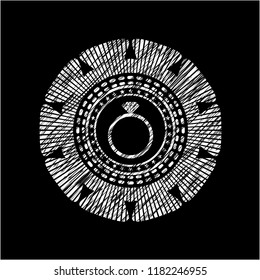 diamond ring icon inside chalk emblem written on a blackboard