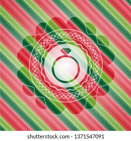 diamond ring icon inside christmas colors badge.