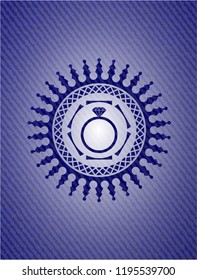 diamond ring icon inside emblem with jean background