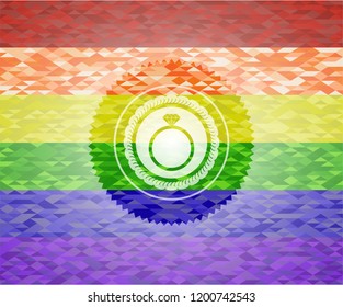 diamond ring icon inside emblem on mosaic background with the colors of the LGBT flag