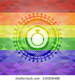 diamond ring icon inside emblem on mosaic background with the colors of the LGBT flag