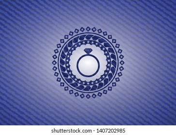 diamond ring icon inside emblem with jean background