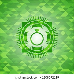 diamond ring icon inside green emblem. Mosaic background