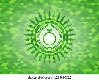 diamond ring icon inside green emblem with triangle mosaic background