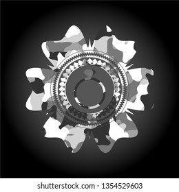 diamond ring icon inside grey camouflage emblem