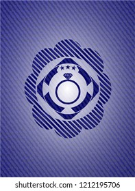 diamond ring icon inside jean or denim emblem or badge background