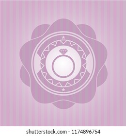diamond ring icon inside pink emblem
