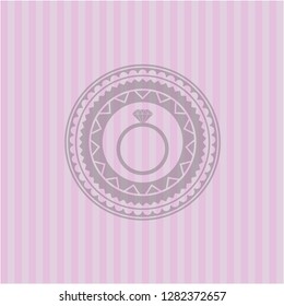 diamond ring icon inside pink emblem
