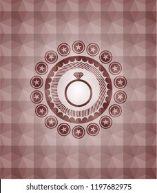  diamond ring icon inside red seamless emblem with geometric pattern background.