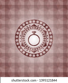 diamond ring icon inside red seamless emblem with geometric pattern background.