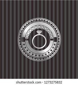 diamond ring icon inside silvery badge