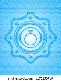 diamond ring icon inside sky blue water badge.