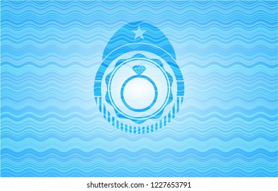 diamond ring icon inside water concept emblem.