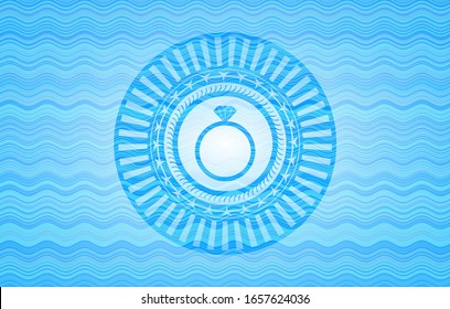 diamond ring icon inside water emblem background.