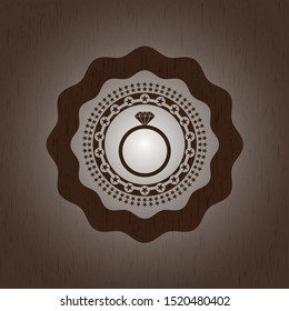 diamond ring icon inside wood badge or emblem