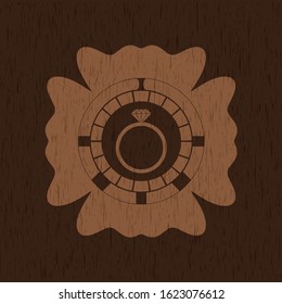 diamond ring icon inside wooden emblem
