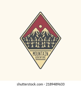 diamond shaped emblem of pine forest mountain