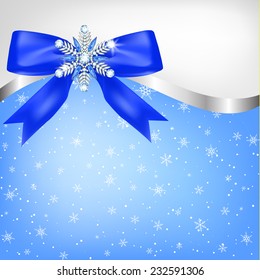 Diamond snowflake with bow on blue background