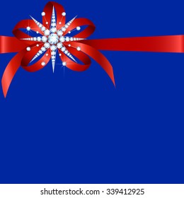 Diamond snowflake with red ribbon and bow on blue