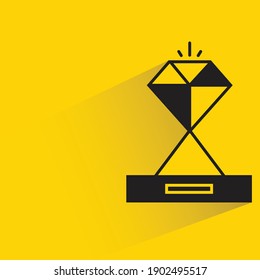 diamond trophy with shadow on yellow background