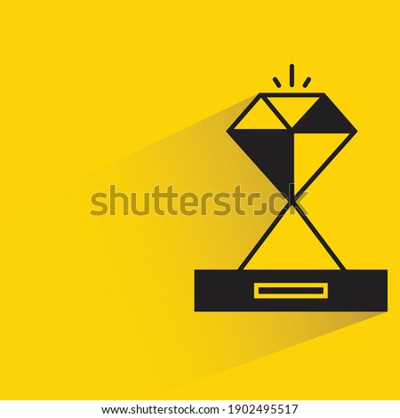 diamond trophy with shadow on yellow background