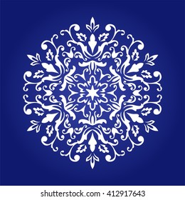 Die cut paper card with cutout mandala ornament. 