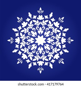 Die cut paper card with cutout mandala ornament. 