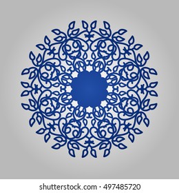 Die cut paper card with cutout mandala ornament.