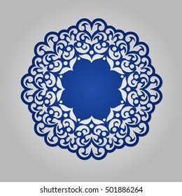 Die cut paper card with cutout mandala ornament. 