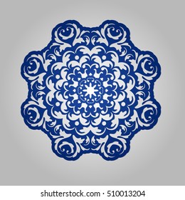 Die cut paper card with cutout mandala ornament. 