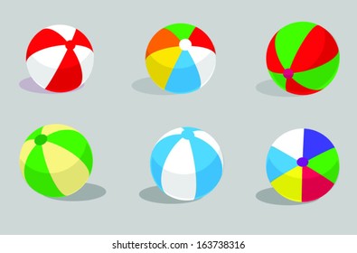 different beach balls on the grey background,children toys,