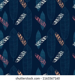 different beautiful feathers are drawn on a dark blue background. Seamless pattern.