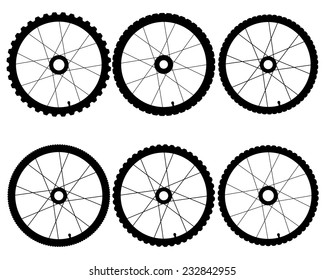 different bicycle wheels on a white background