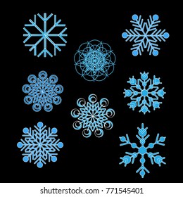 different blue snowflakes on black fon