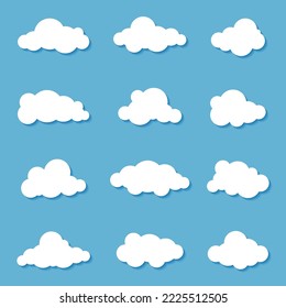Different clouds on blue sky in origami design. Collection of white paper cut out cloud icons. Paper cloud. Weather symbols. Vector illustration
