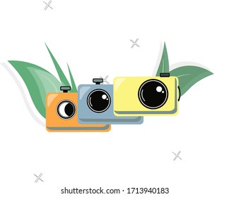 
Different color cameras. Composition of the camera with leaves