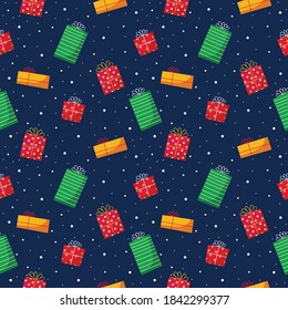 different color gift boxes seamless pattern isolated on blue background. vector Illustration.